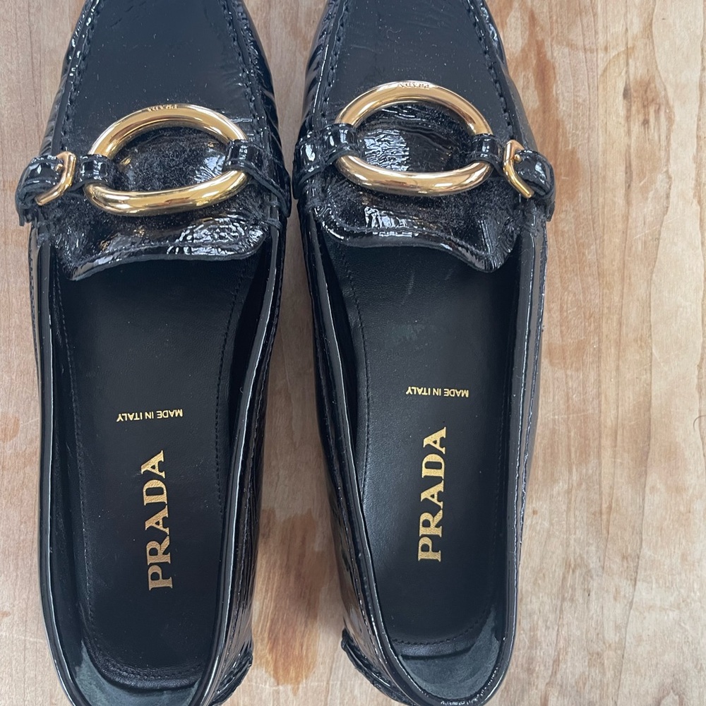 Prada Black Leather Loafers with Gold Embellishment